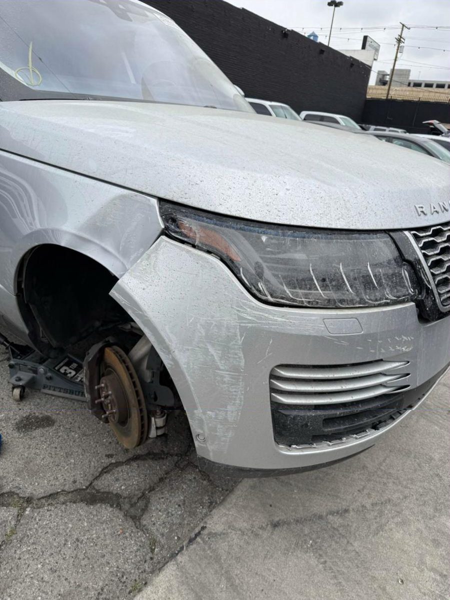 Range Rover with front fender and bumper damage